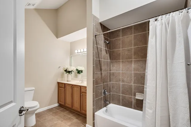 a big house with a big yard and large trees