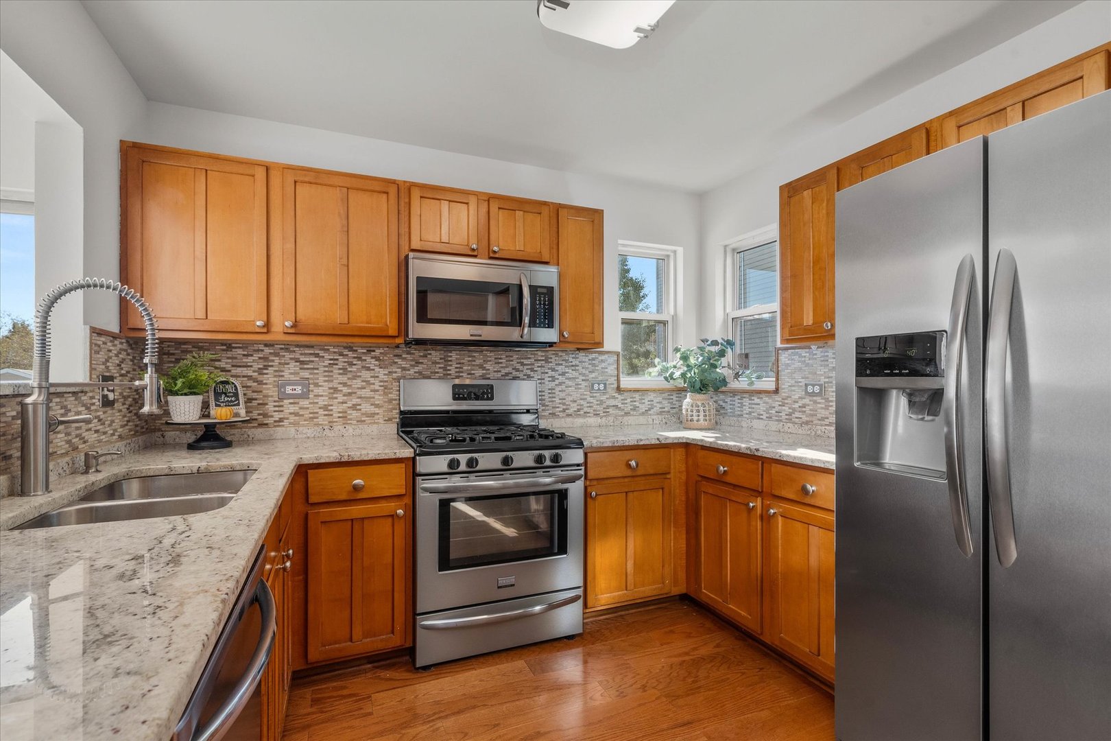 2152 Brayton Place Plainfield, IL 60586 - Photo 8 of 28 a kitchen with stainless steel appliances granite countertop a stove a refrigerator and a sink