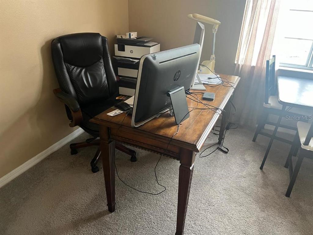 609 Prince Lane Oviedo, FL 32765 - Photo 11 of 20 a view of workspace with wooden floor windows
