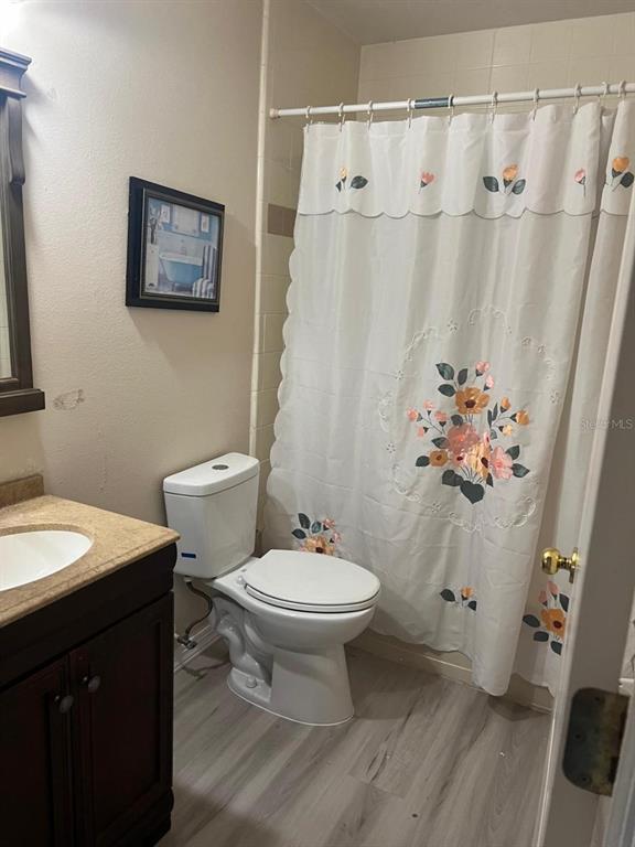609 Prince Lane Oviedo, FL 32765 - Photo 13 of 20 a bathroom with a sink toilet and a mirror