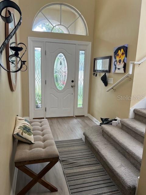 609 Prince Lane Oviedo, FL 32765 - Photo 2 of 20 a bedroom with a bed and a chandelier