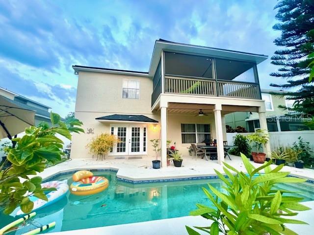 609 Prince Lane Oviedo, FL 32765 - Photo 9 of 20 a front view of a house with a yard table and chairs
