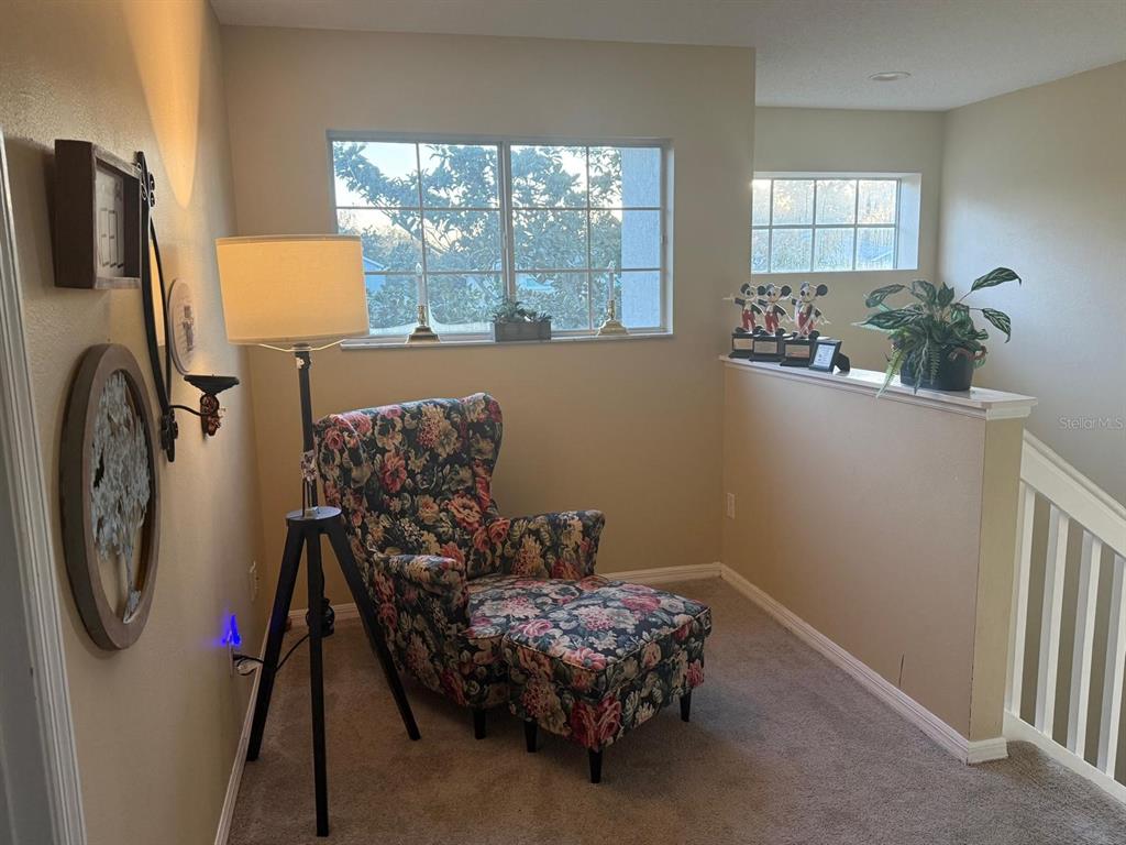 609 Prince Lane Oviedo, FL 32765 - Photo 10 of 20 a bed room with a bed and a chair