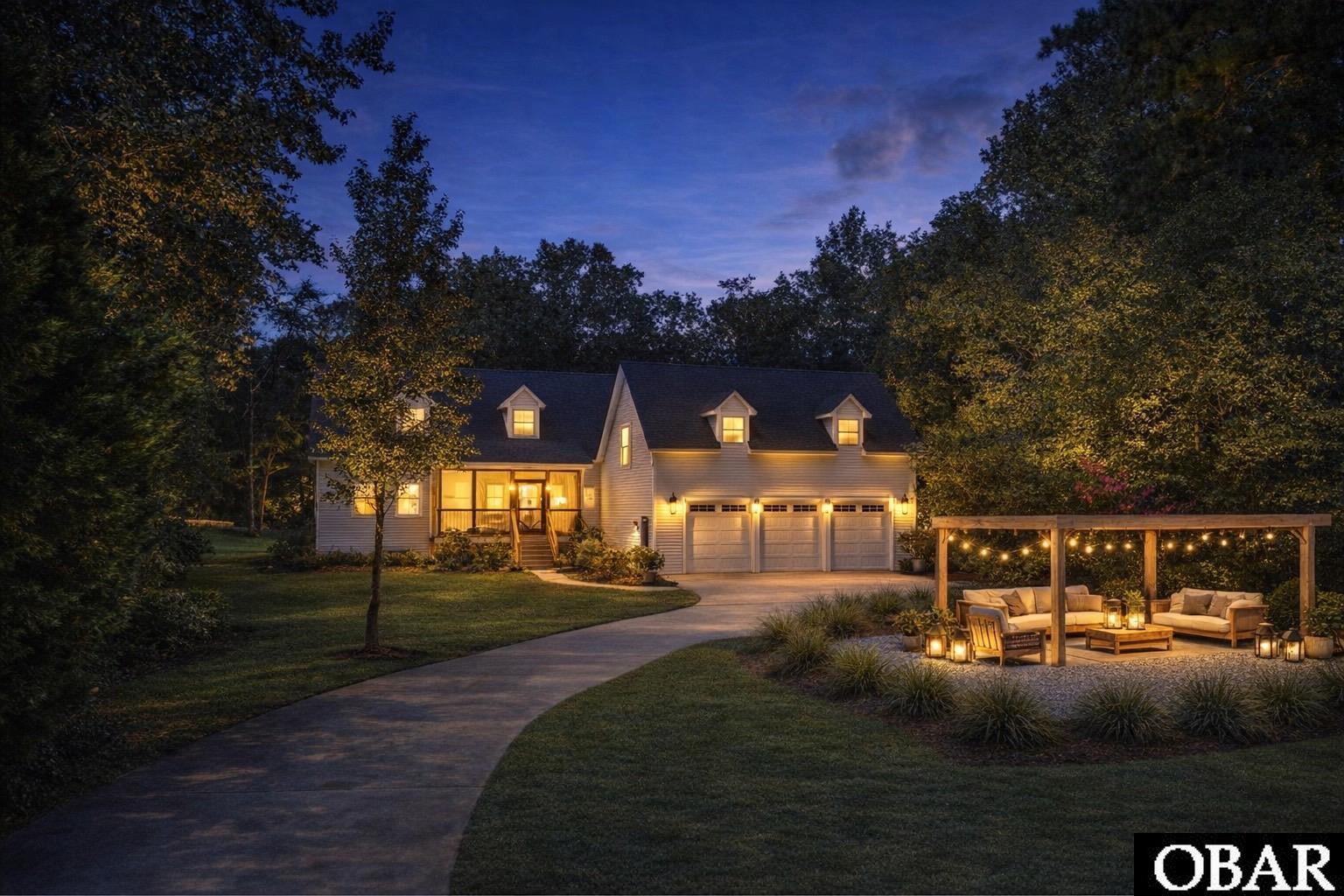 5124 The Woods Road Kitty Hawk, NC 27949 - Photo 1 of 1 Outdoor Lighting Staged