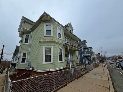 a front view of a house with glass windows