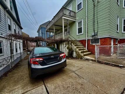 a car parked in front of a house