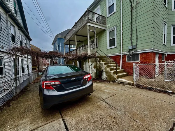 a car parked in front of a house