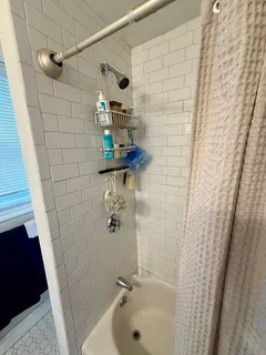 a bathroom with a sink and shower