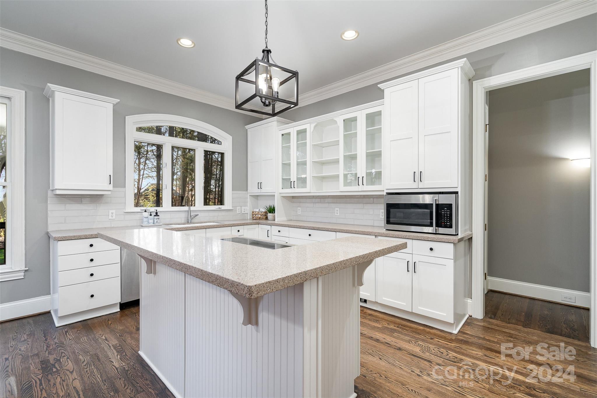 128 Mayfair Road Mooresville, NC 28117 - Photo 12 of 35 a kitchen with a stove a sink and a refrigerator
