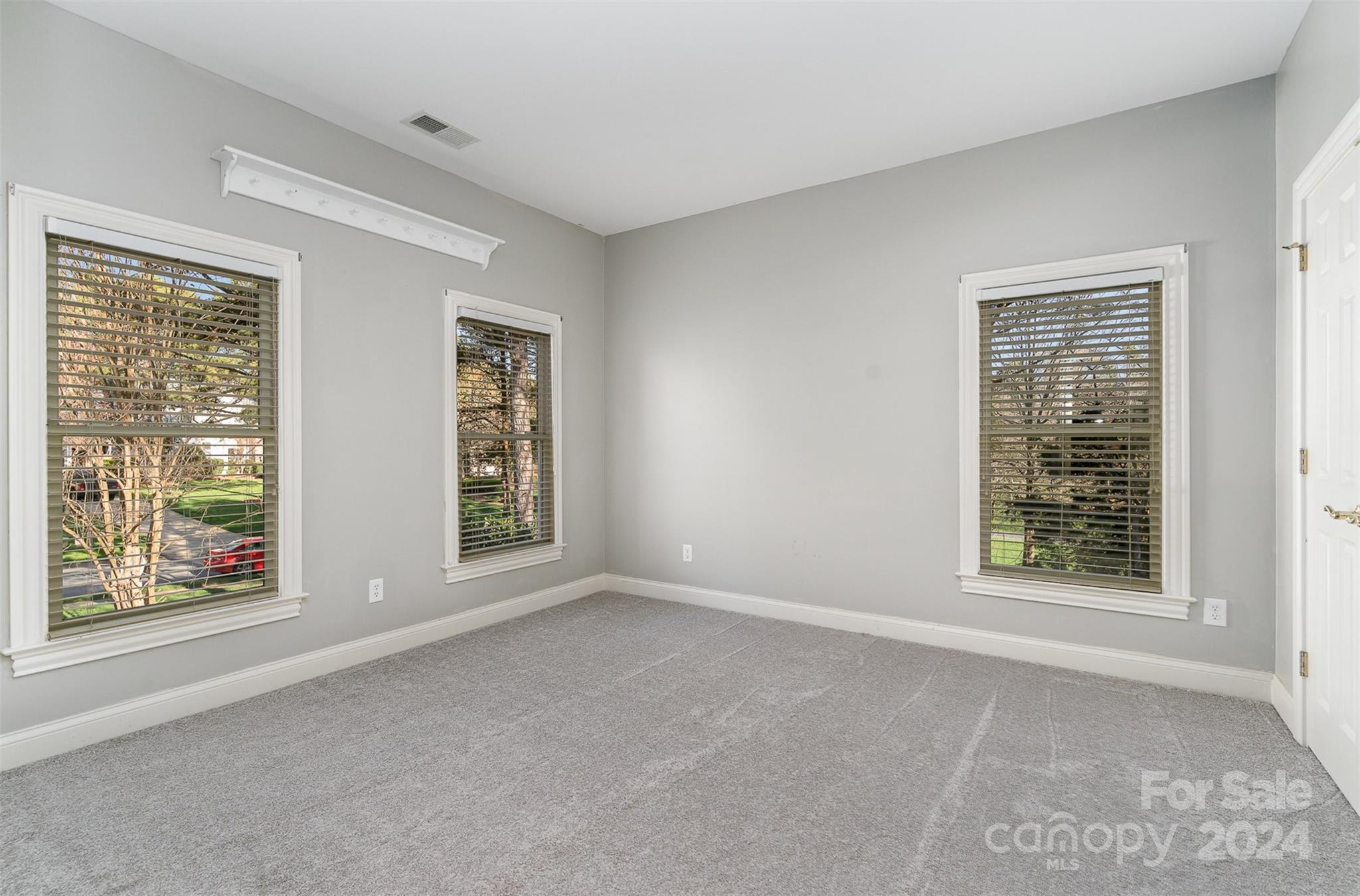 128 Mayfair Road Mooresville, NC 28117 - Photo 18 of 35 a view of an empty room with windows