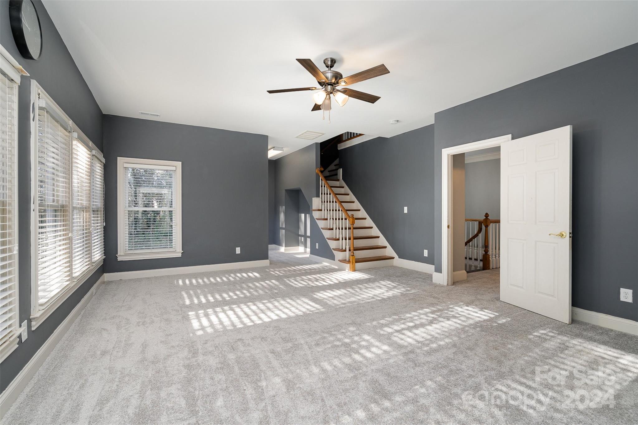128 Mayfair Road Mooresville, NC 28117 - Photo 20 of 35 a view of an empty room with wooden floor and a window