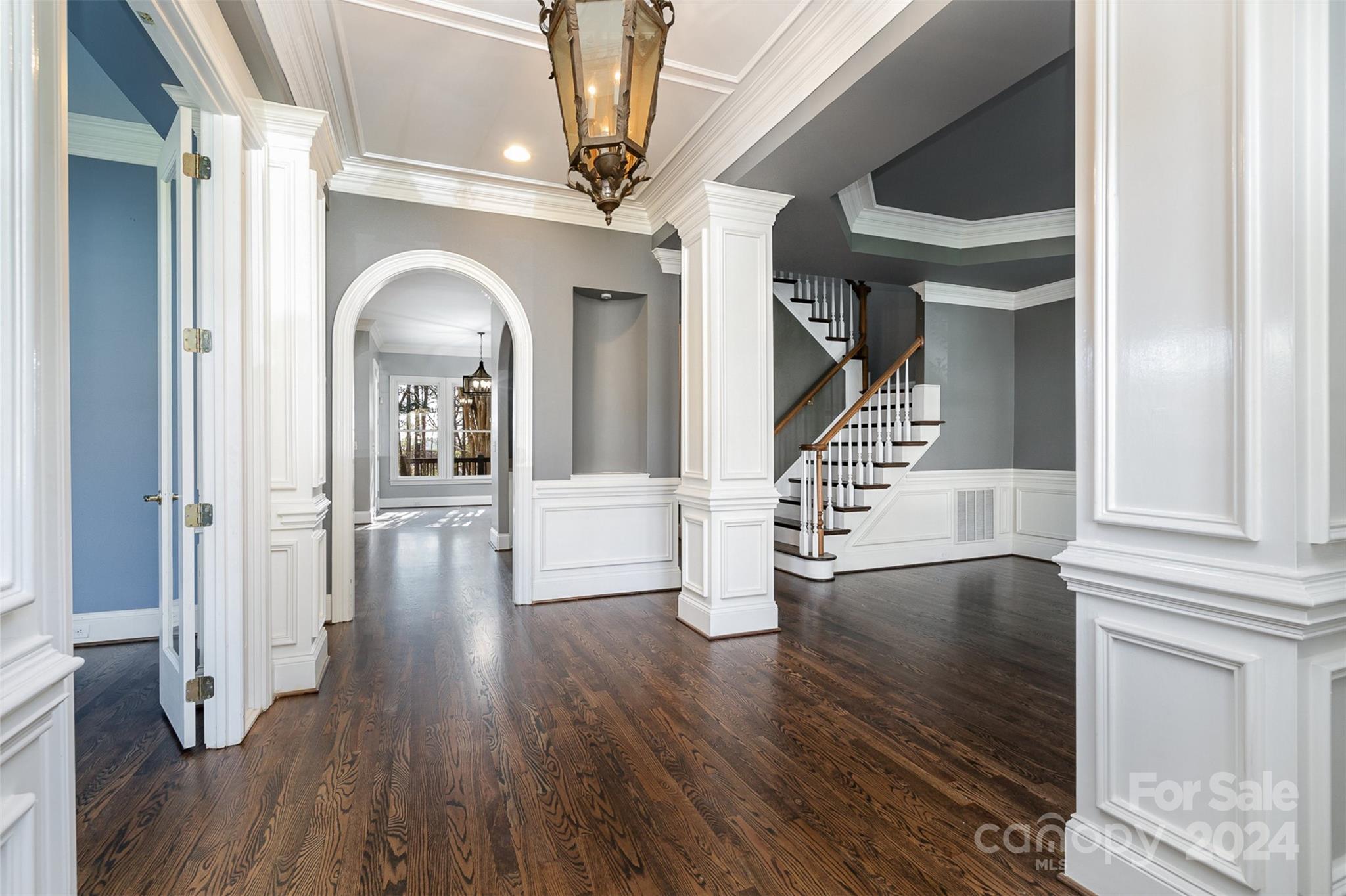 128 Mayfair Road Mooresville, NC 28117 - Photo 3 of 35 a view of entryway and hall with wooden floor