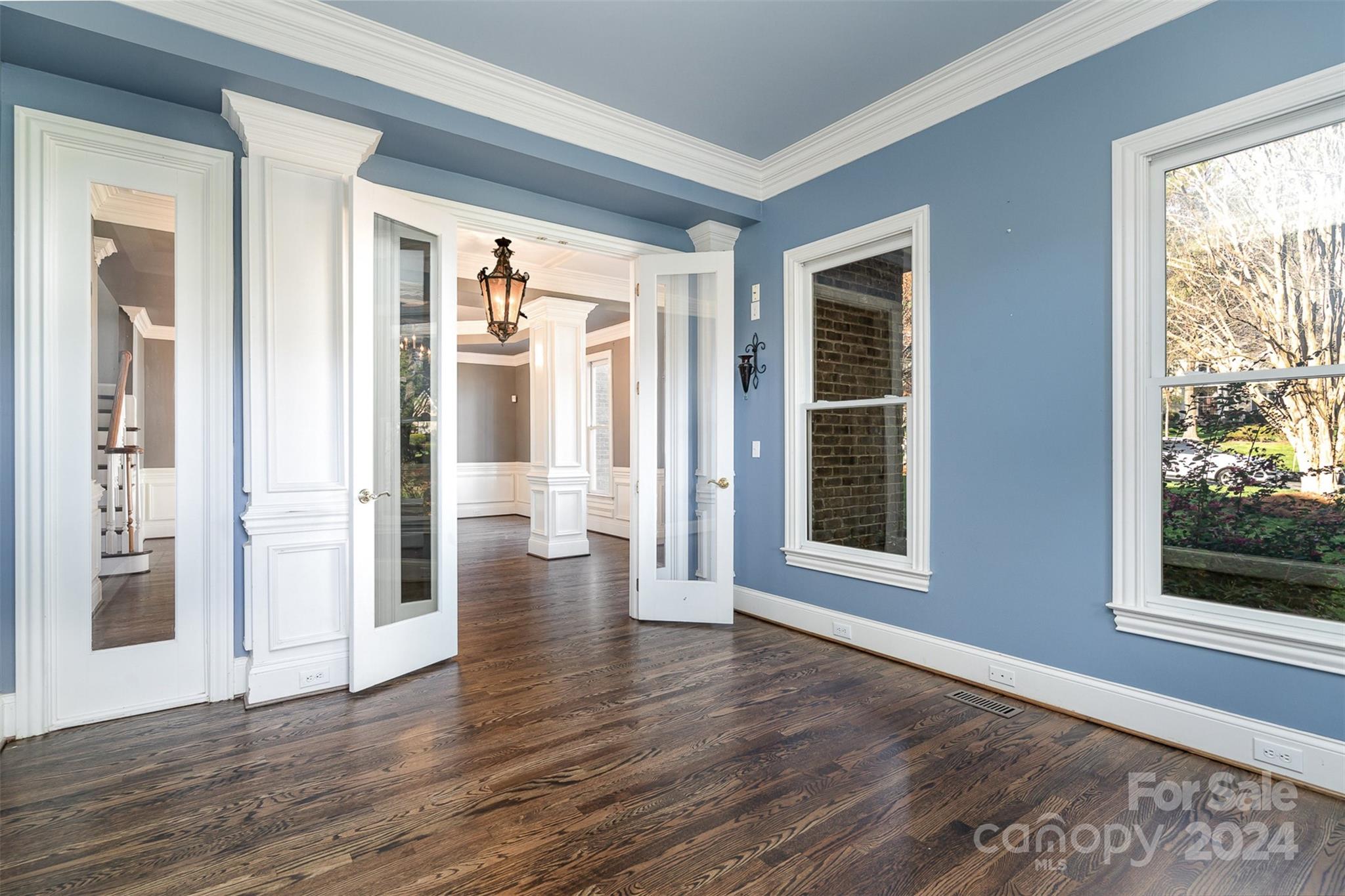 128 Mayfair Road Mooresville, NC 28117 - Photo 7 of 35 a view of an empty room with wooden floor and a window