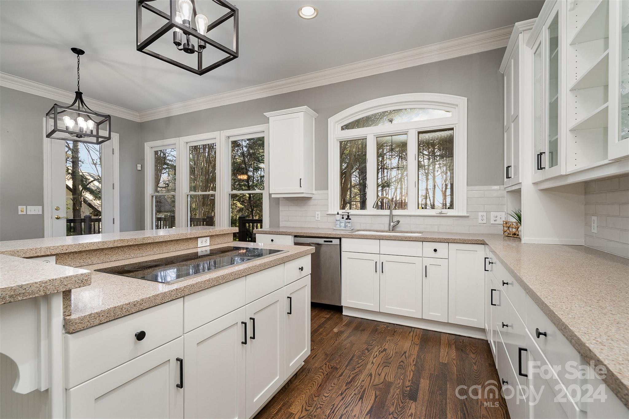 128 Mayfair Road Mooresville, NC 28117 - Photo 10 of 35 a kitchen that has a lot of cabinets in it and wooden floors