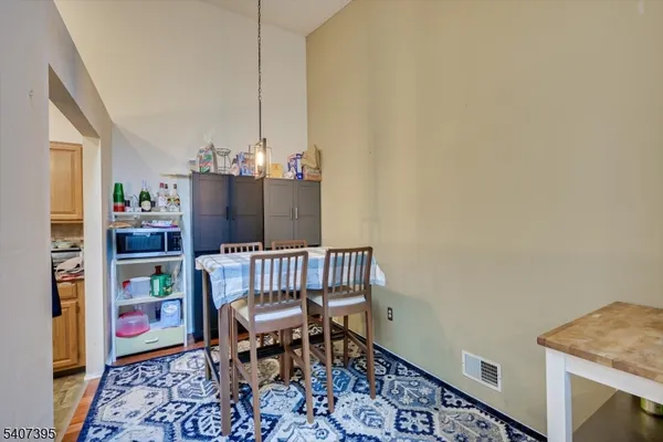 a kitchen with stainless steel appliances granite countertop a stove a sink and a white cabinets