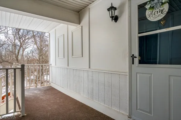 a view of an entryway with a wooden floor