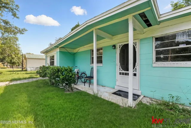 a view of backyard with a garden and plants