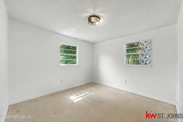 an empty room with windows