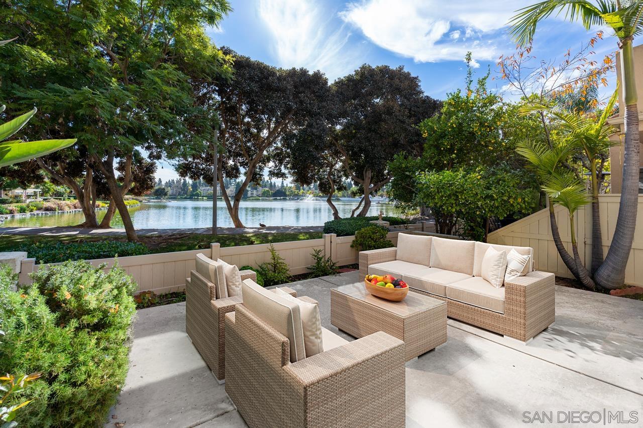 a view of a patio with couches and a fire pit