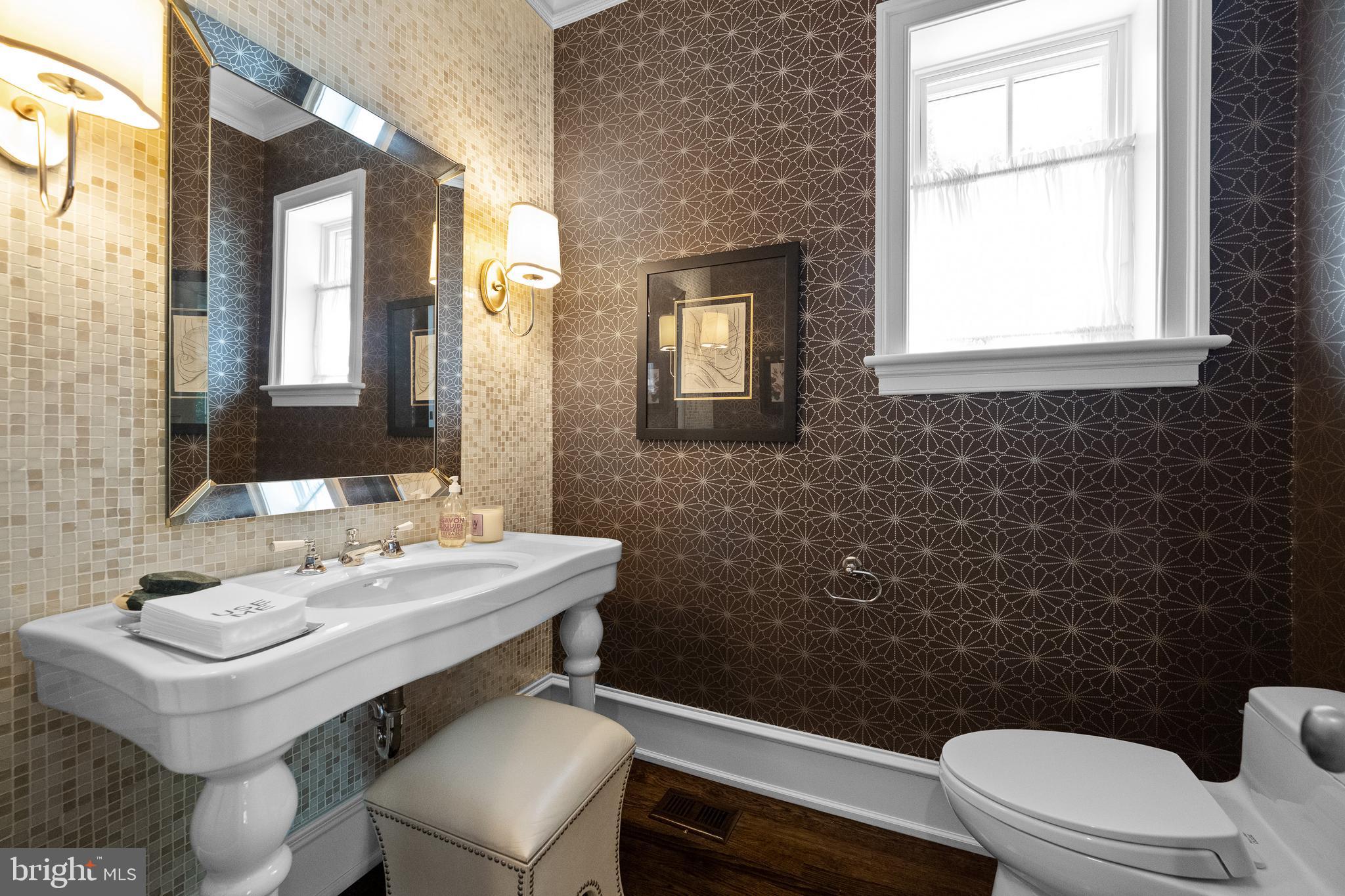 423 North Spring Mill Road Villanova, PA 19085 - Photo 26 of 67 a bathroom with a sink a toilet and mirror