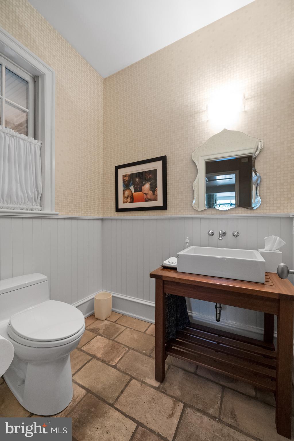 423 North Spring Mill Road Villanova, PA 19085 - Photo 27 of 67 a bathroom with a toilet a sink and mirror