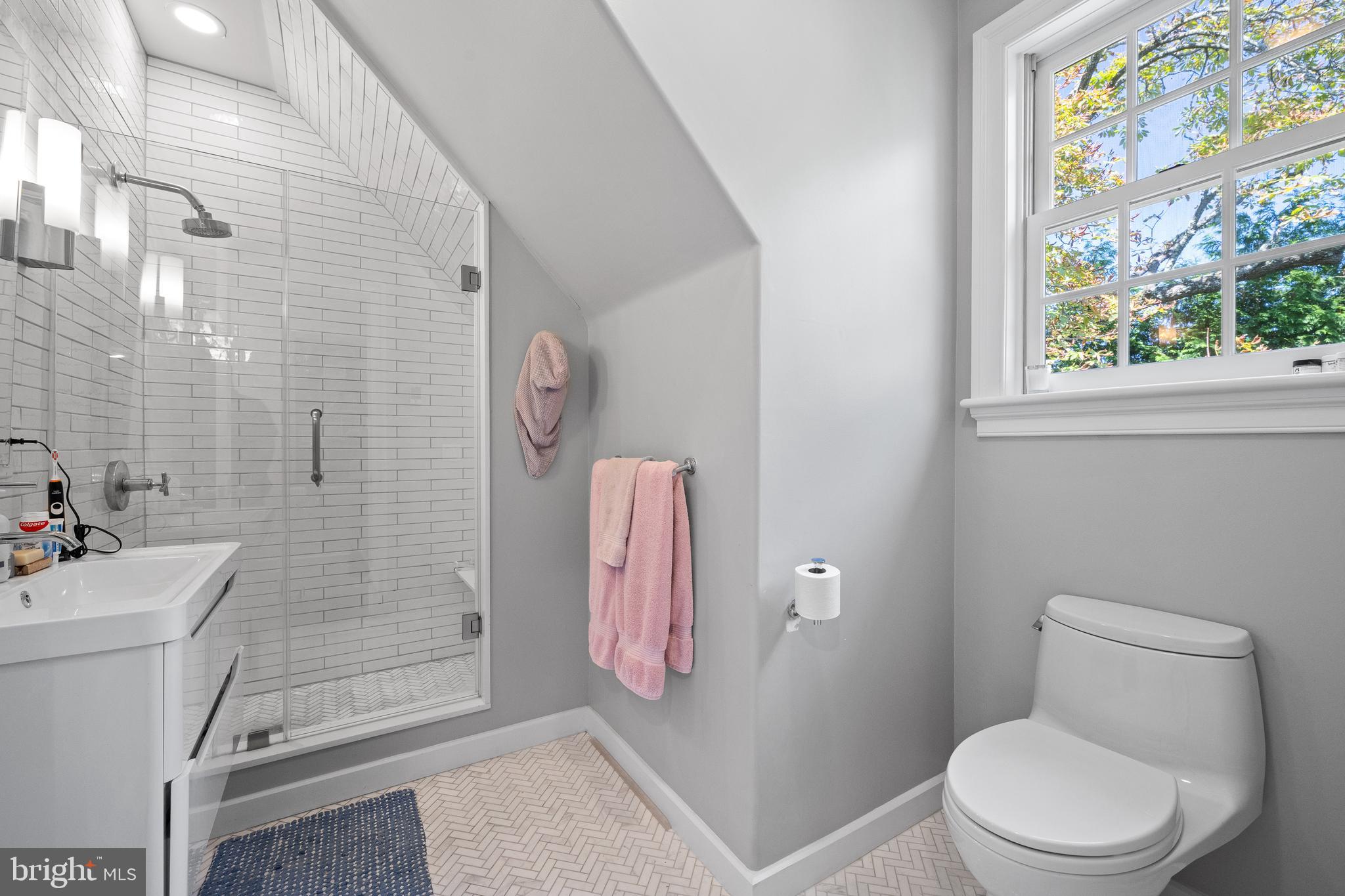 423 North Spring Mill Road Villanova, PA 19085 - Photo 36 of 67 a bathroom with a toilet sink and shower