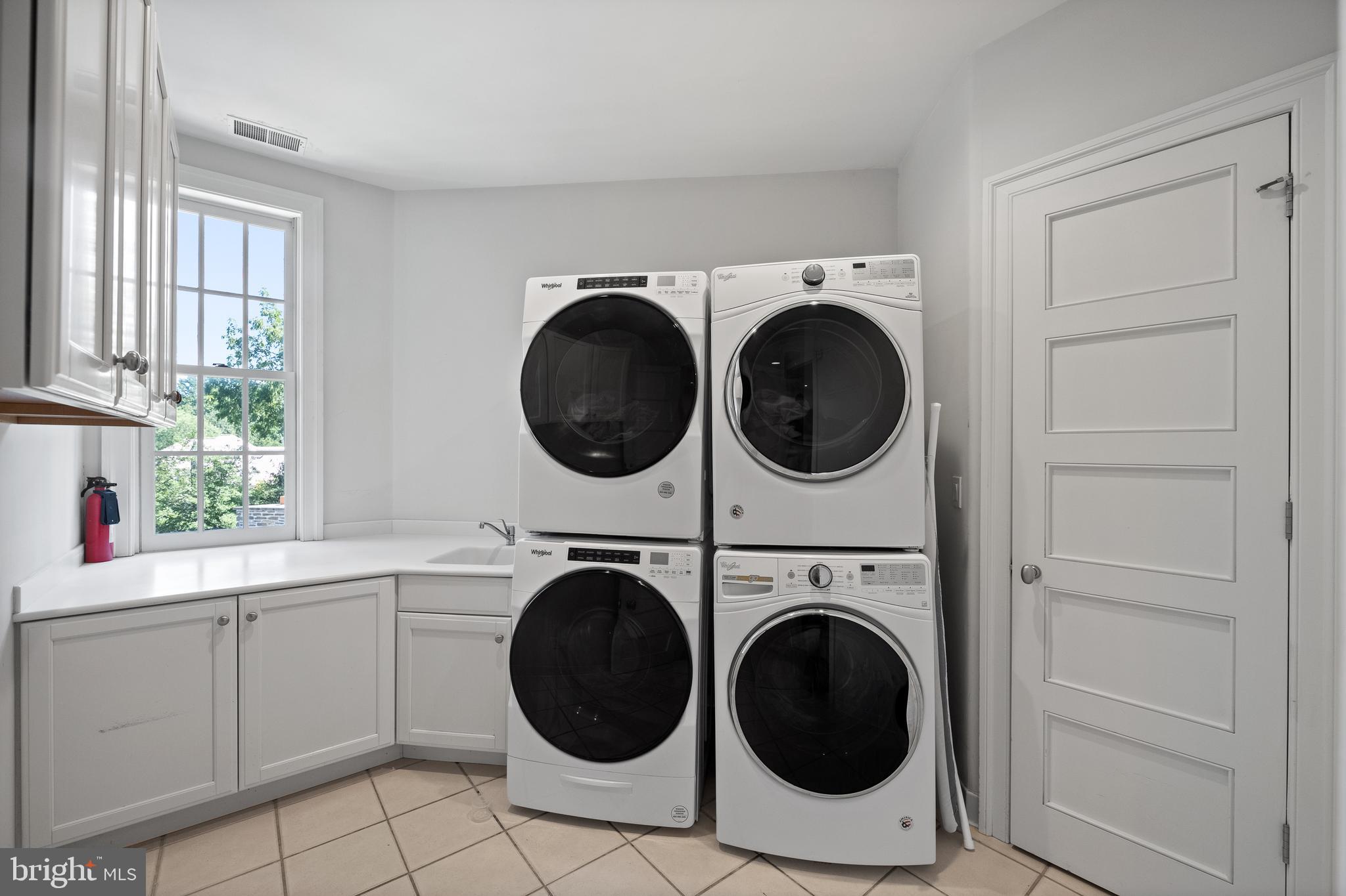423 North Spring Mill Road Villanova, PA 19085 - Photo 46 of 67 a utility room with sink dryer and washer