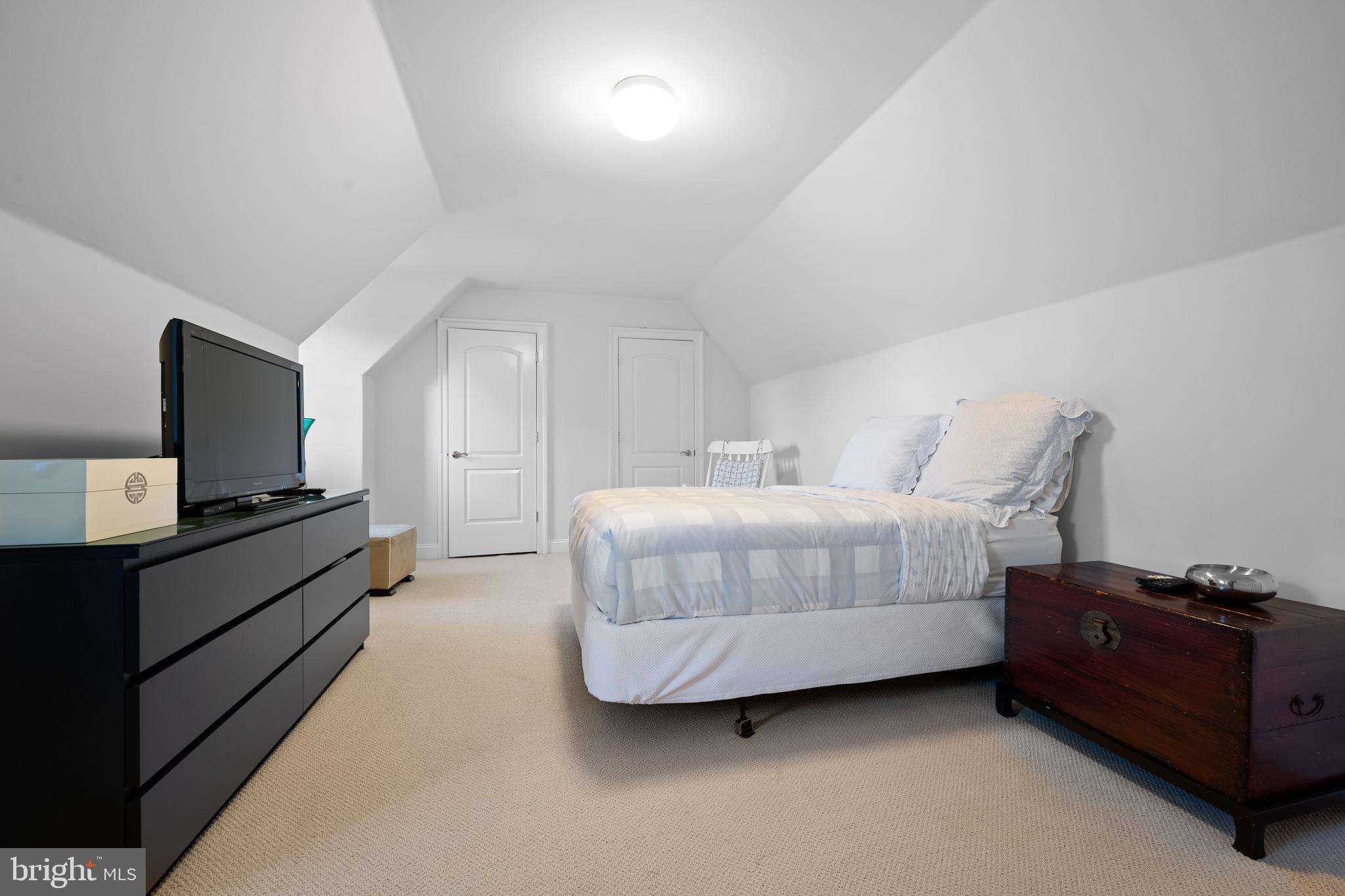 423 North Spring Mill Road Villanova, PA 19085 - Photo 49 of 67 a spacious bedroom with a bed and a tv