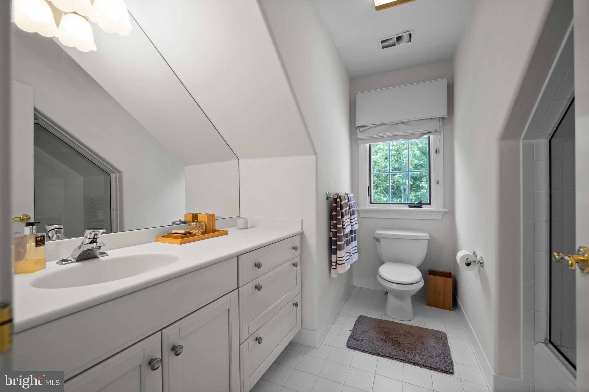 423 North Spring Mill Road Villanova, PA 19085 - Photo 50 of 67 a bathroom with a sink toilet and window
