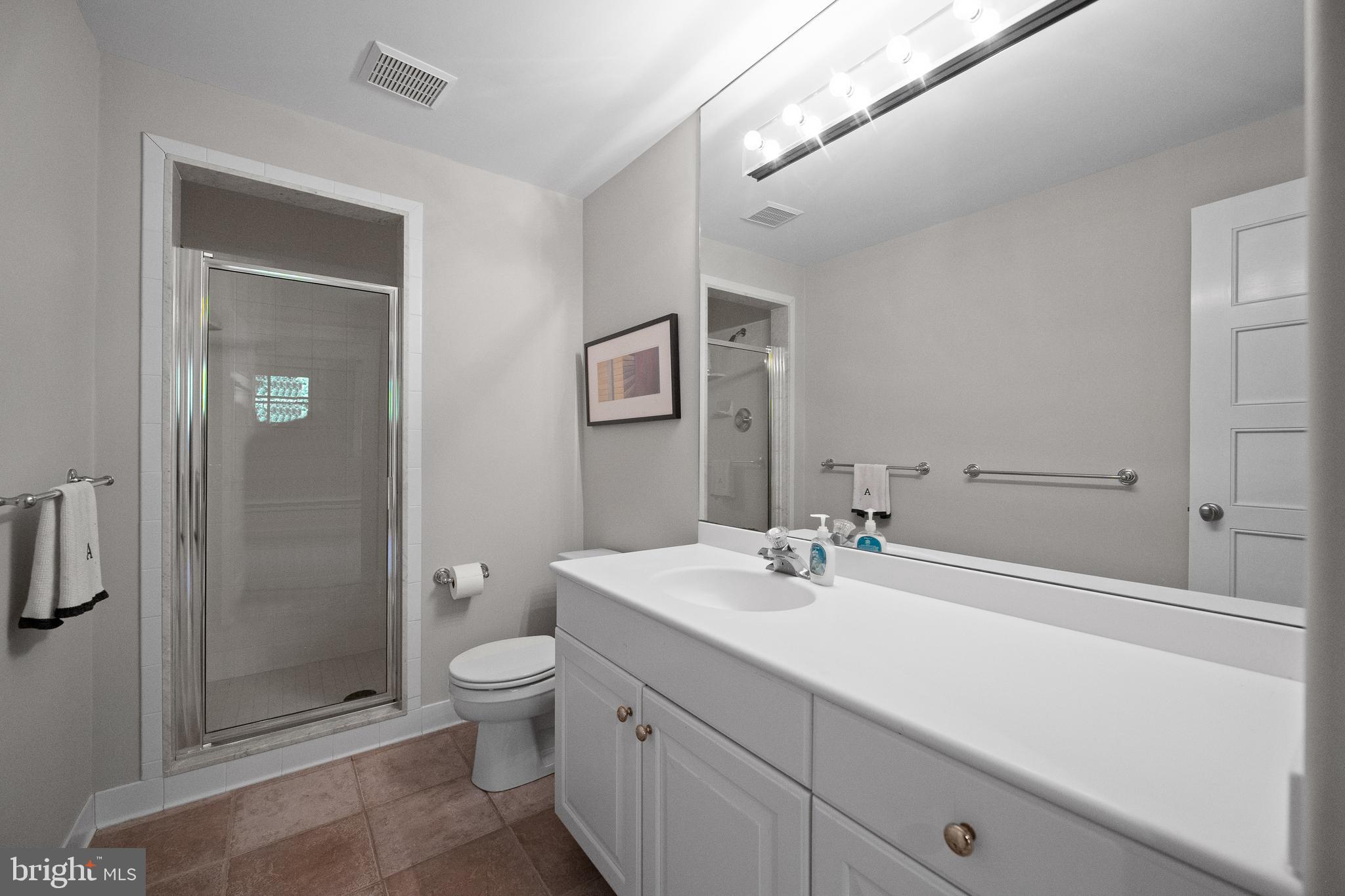 423 North Spring Mill Road Villanova, PA 19085 - Photo 54 of 67 a bathroom with a sink a toilet and shower