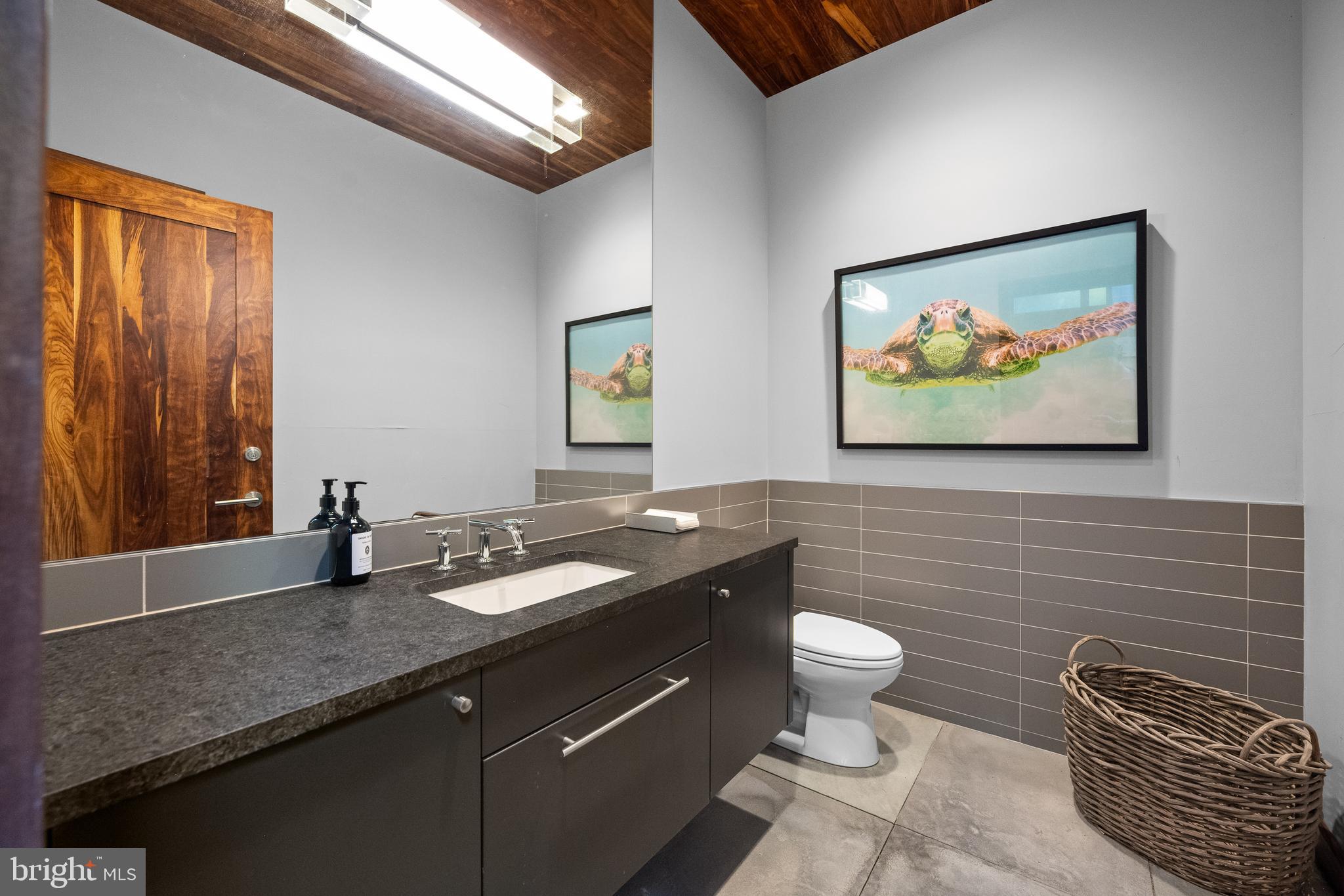 423 North Spring Mill Road Villanova, PA 19085 - Photo 60 of 67 a bathroom with a granite countertop sink a toilet and a mirror