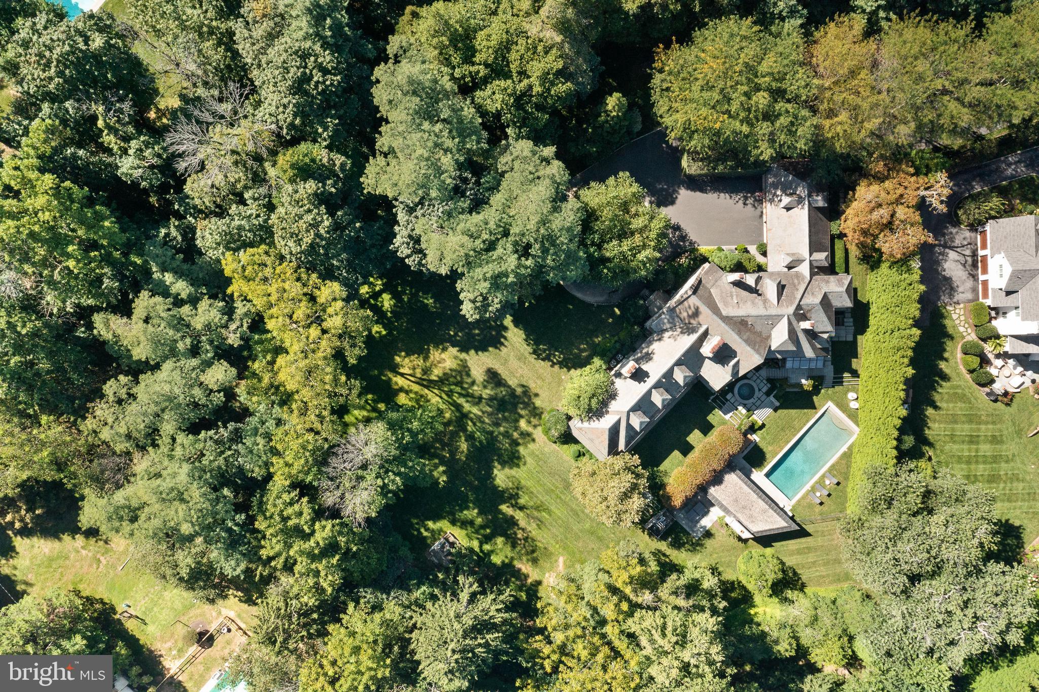 423 North Spring Mill Road Villanova, PA 19085 - Photo 67 of 67 an aerial view of residential house with outdoor space and trees all around