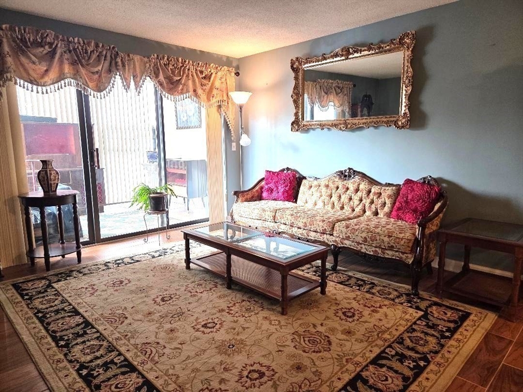 4234 North Main Street, Unit 103 Fall River, MA 02720 - Photo 4 of 10 a living room with furniture and a window