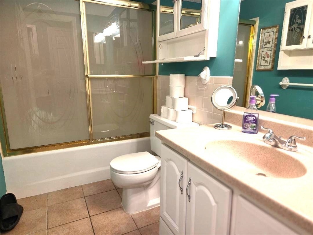 4234 North Main Street, Unit 103 Fall River, MA 02720 - Photo 10 of 10 a bathroom with a sink a toilet and shower