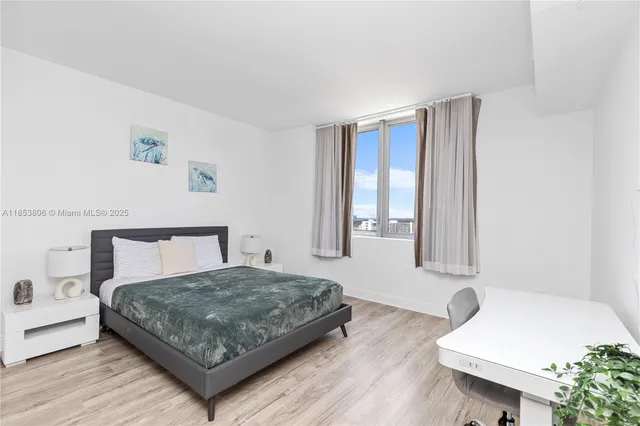 a bedroom with a bed and a couch