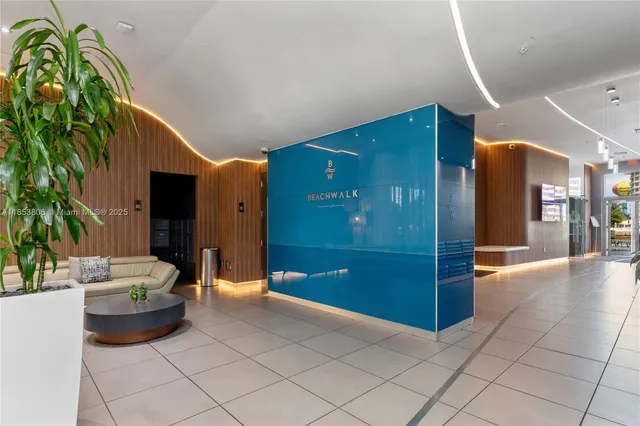 a view with granite countertop a sink and a mirror