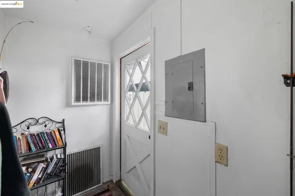 a view of an entryway with wooden floor