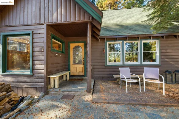 a view of house with outdoor seating space