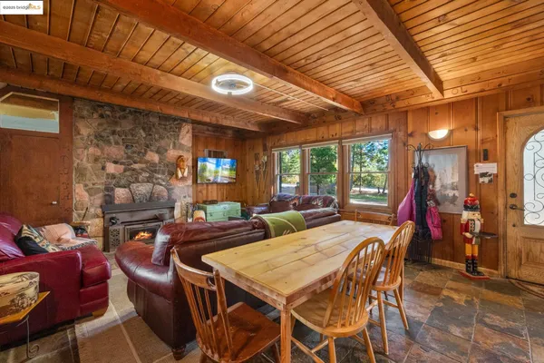 a view of a dining room with furniture window and outside view