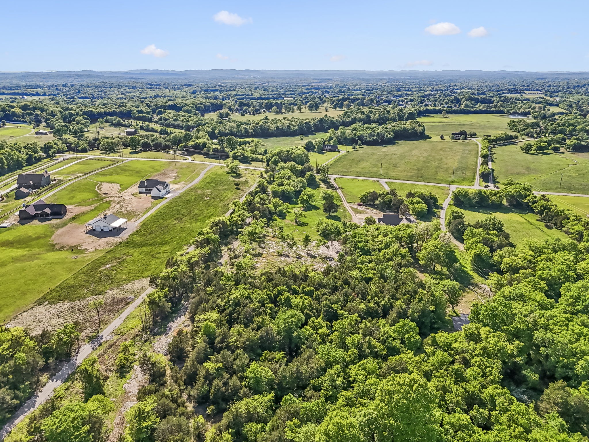 10567 Versailles Road Murfreesboro, TN 37128 - Photo 14 of 25 an aerial view of residential houses with outdoor space and river