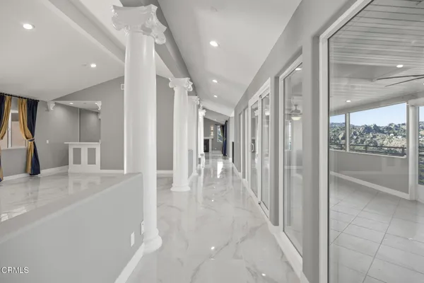 a view of a livingroom with a ceiling fan and window