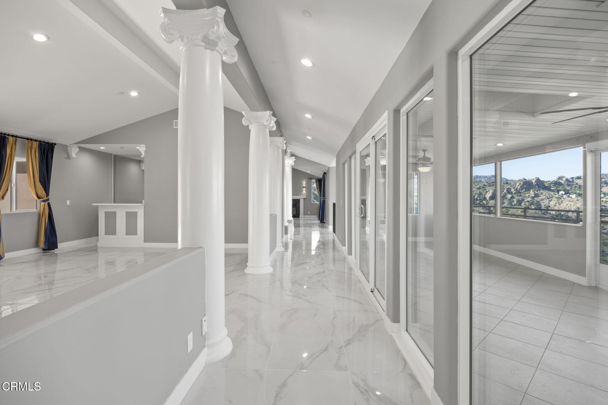 40 Saddlebow Road Bell Canyon, CA 91307 - Photo 12 of 70 a view of a hallway with wooden floor and a kitchen
