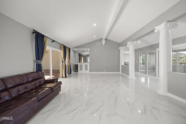 a view of cabinets and kitchen with wooden floor