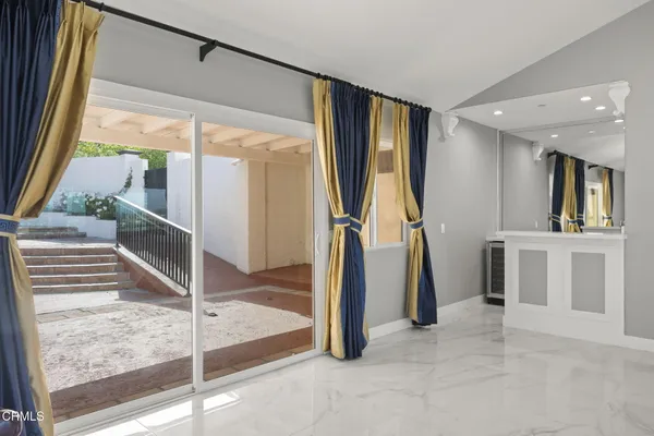 a large bathroom with a large mirror vanity and shower