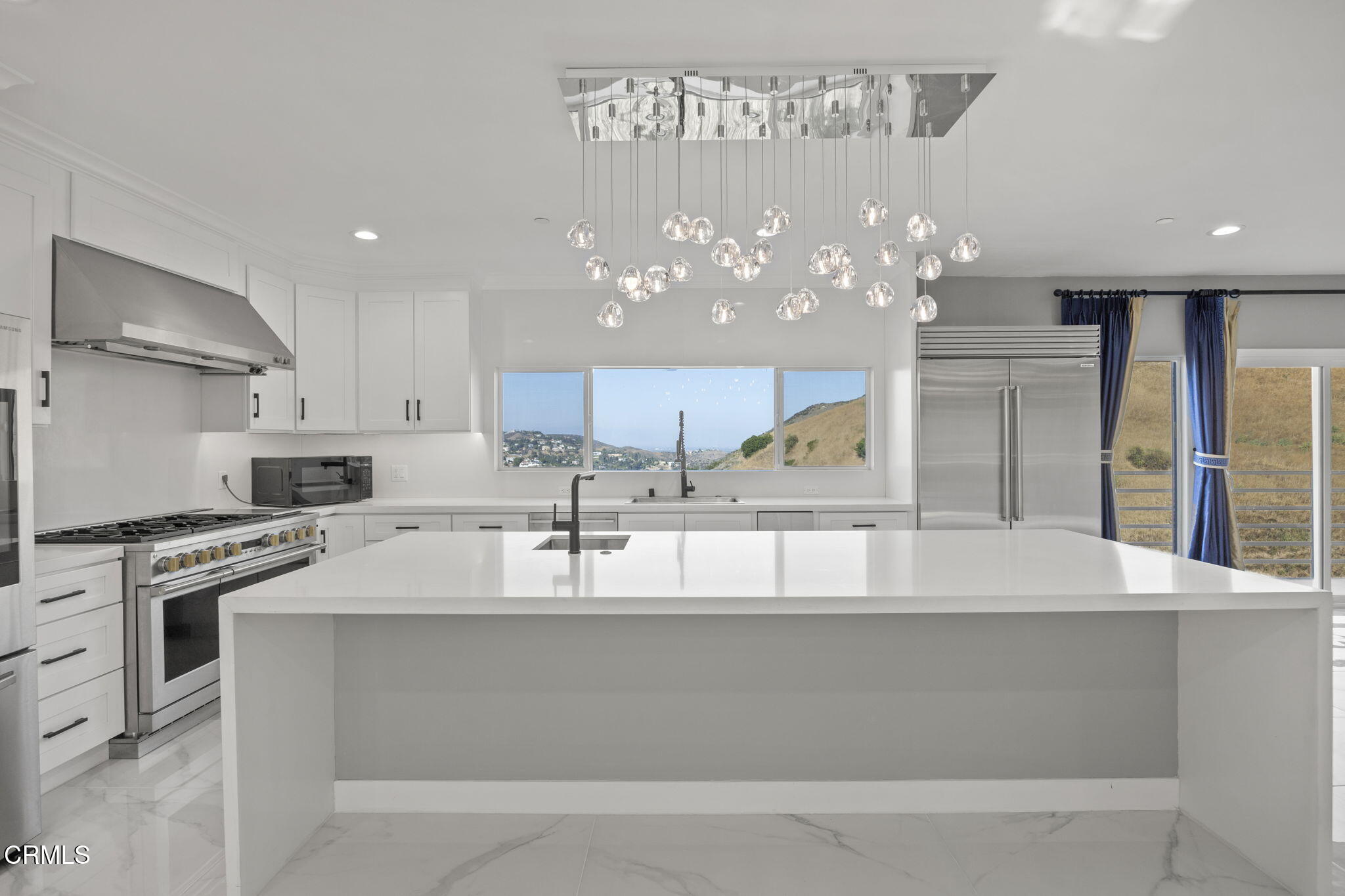 40 Saddlebow Road Bell Canyon, CA 91307 - Photo 22 of 70 a large kitchen with granite countertop a large counter top stainless steel appliances and cabinets