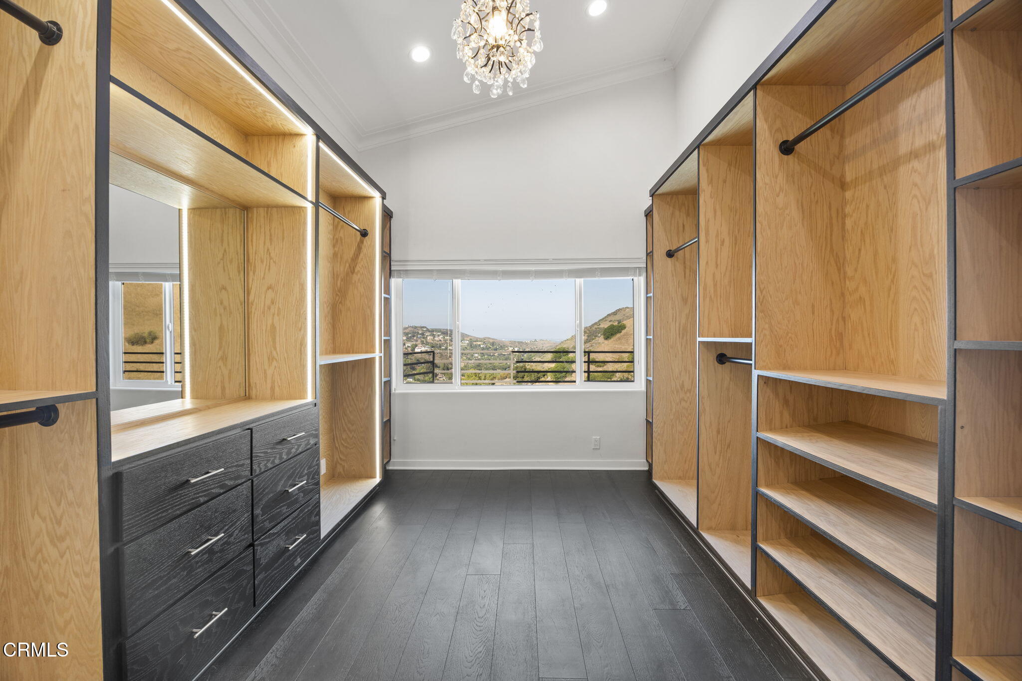 40 Saddlebow Road Bell Canyon, CA 91307 - Photo 41 of 70 a view of walk in closet with wooden floor and fan
