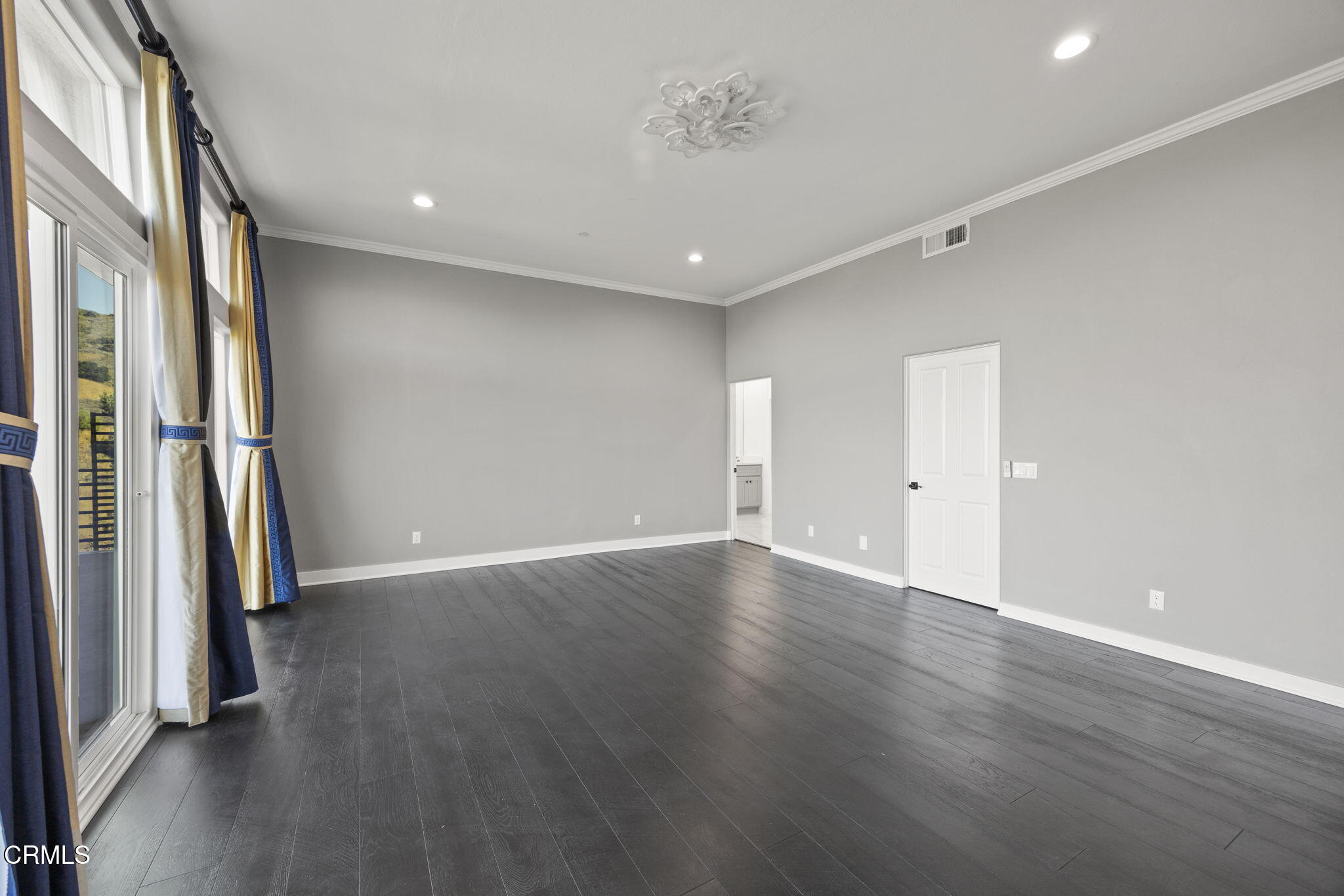 40 Saddlebow Road Bell Canyon, CA 91307 - Photo 46 of 70 an empty room with wooden floor and entrance