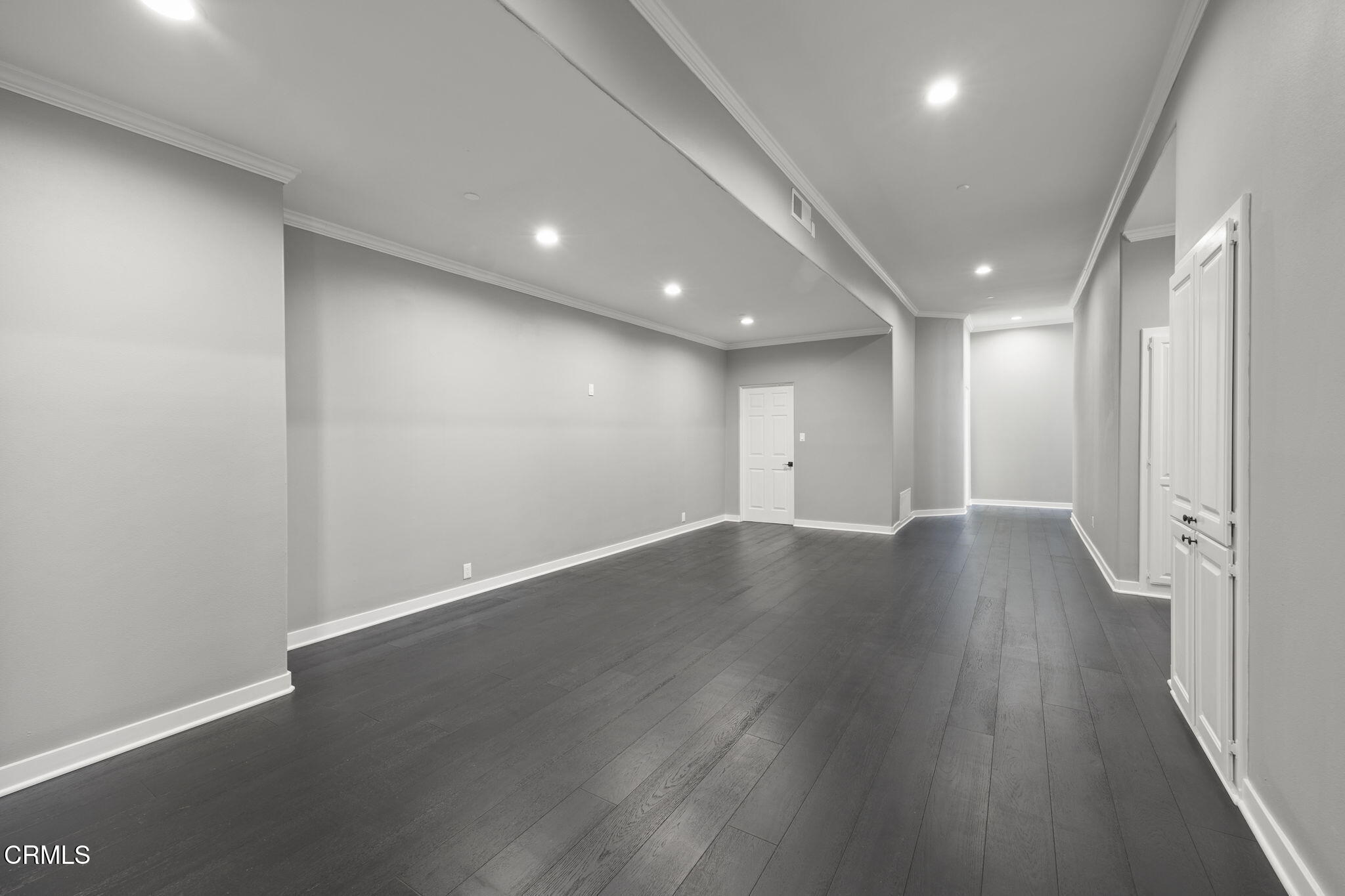 40 Saddlebow Road Bell Canyon, CA 91307 - Photo 49 of 70 an empty room with wooden floor and windows