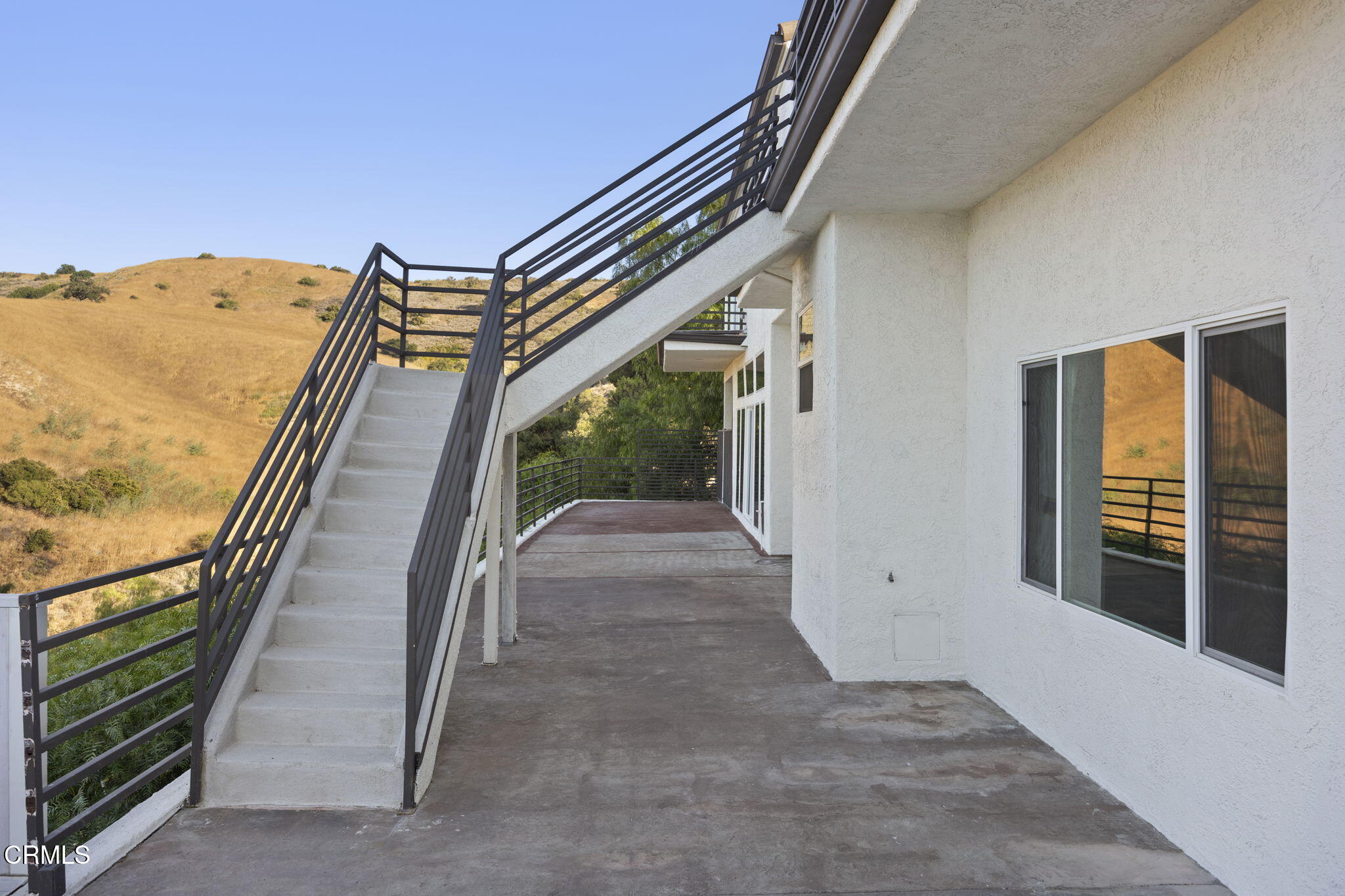 40 Saddlebow Road Bell Canyon, CA 91307 - Photo 60 of 70 a view of a hallway with wooden floor and stairs