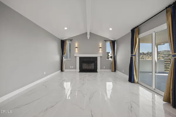 a view of a livingroom with a fireplace